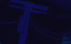 Blue character playing video game