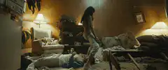 Woman stomps on man's head in messy room