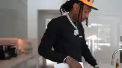 Travis Scott hands over a joint