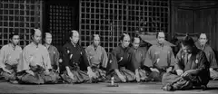 Samurai bowing and asking for money