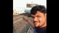 Man points at train then camera spins