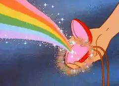 Hand holding rainbow heart