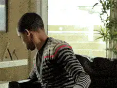 Man eating popcorn on couch