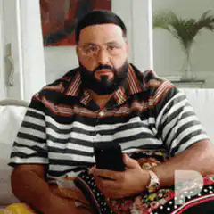 DJ Khaled looking at phone then reacting