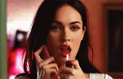 Megan Fox licks a lighter
