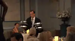 Waiter drops silver platters