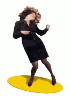 Woman in black suit dancing on yellow oval
