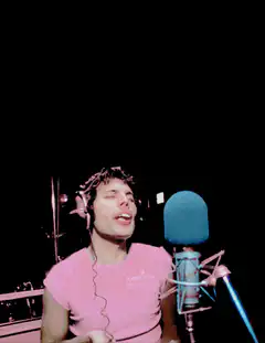 Jesse Eisenberg singing into a microphone