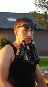 man with beer bottles on chest