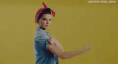 Woman flexing bicep like Rosie the Riveter