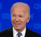Joe Biden smiling and talking