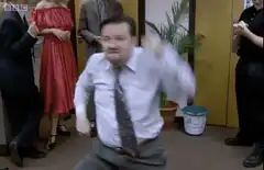 Ricky Gervais dancing in office