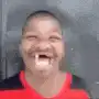 Boy laughing with vampire fangs