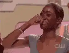 Woman laughing and covering her mouth