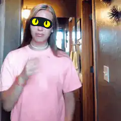girl in pink shirt with cat eyes dancing