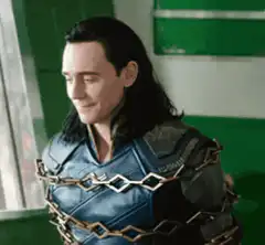 Loki smirking while chained