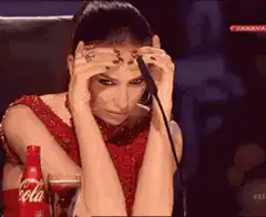 Woman in red dress looking stressed