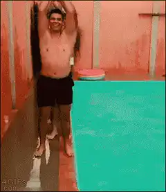 men jumping into pool
