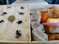 Japanese bento box with rice and dumplings