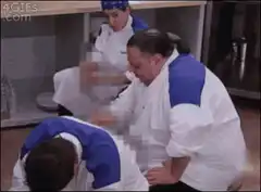 Chefs eating in a kitchen