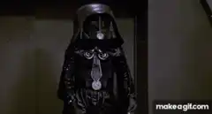 Darth Vader with a long nose and green lightsaber