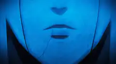 Blue face cracking and grinning