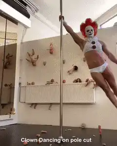 Clown pole dancing with balloon