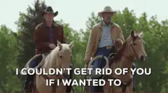 Two cowboys on horses with text