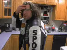 Travis Bickle salutes in kitchen