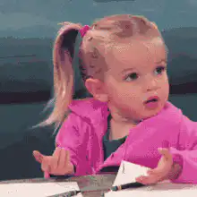 confused little girl shrugging