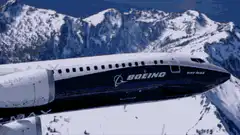 Boeing 737 MAX flying over mountains