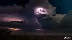 dramatic lightning storm over ocean at night
