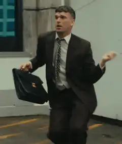 Man in suit running with briefcase