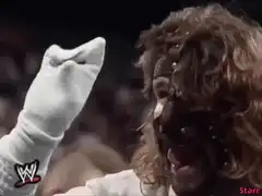 WWE wrestler in mask and glove