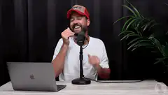 Man laughing and covering face with hand