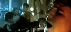 Blind Singer Performing with Crowd