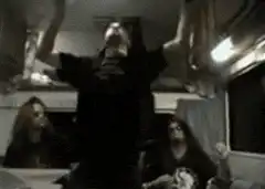 guy in black shirt dancing in van