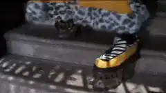 Person in yellow leopard print outfit walking