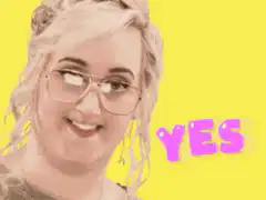 Woman with glasses smiling yes