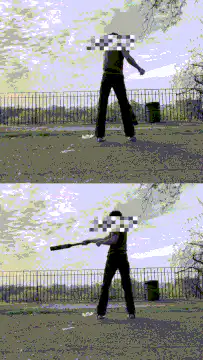 person swinging baseball bat