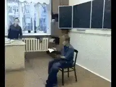student falls off chair in classroom