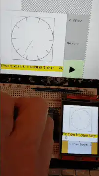 Hand adjusting potentiometer on breadboard