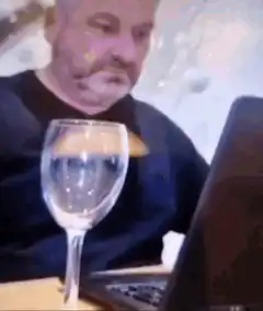 man pours wine while gesturing
