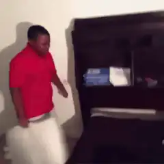 Man in red shirt dancing and shaking