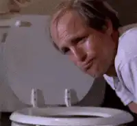Woody Harrelson vomiting into a toilet