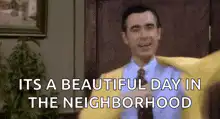 Mr. Rogers changing his sweater