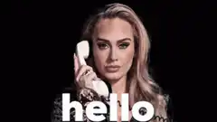 Adele holding phone saying hello