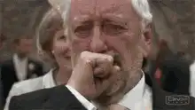 Old man crying in suit