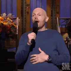 Bill Burr singing with hand on chest