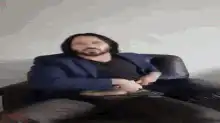 Keanu Reeves holding a knife